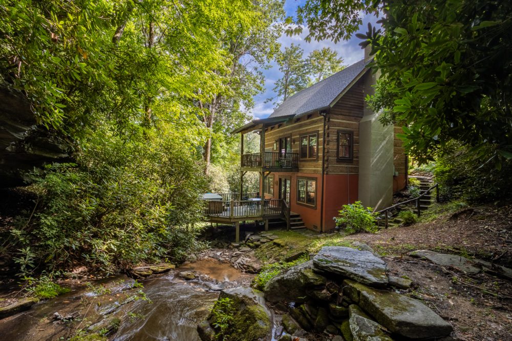 Wooded cabin accommodation beside a stream at Laurel Falls