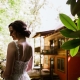 Bride portrait at North Carolina mountain wedding venue with rustic cabin backdrop.
