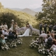Bride and groom sharing their first kiss during an outdoor mountain ceremony at Laurel Falls